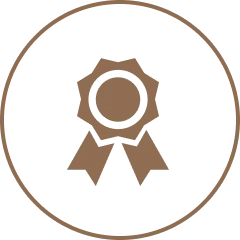 A brown award ribbon inside a circular border.